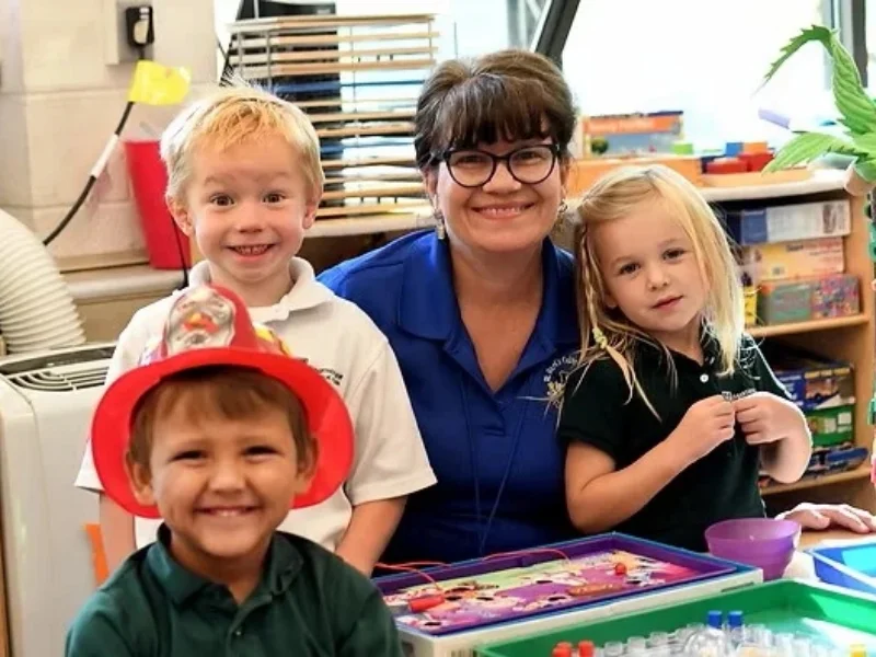 Preschool teacher with 3 students