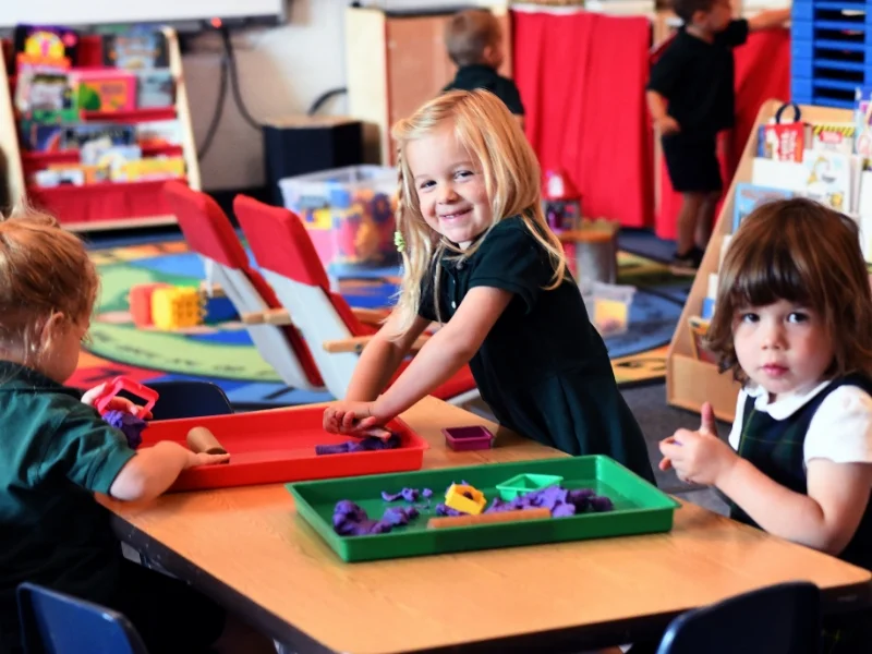 preschool students using playdough